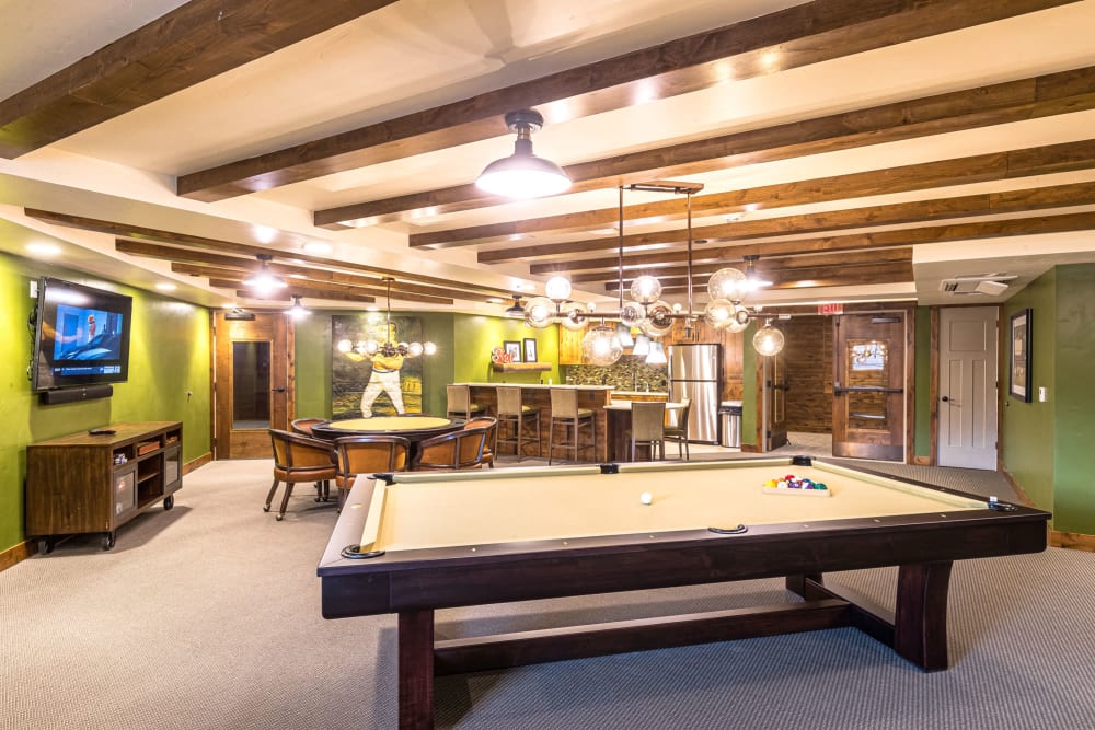 Recreation area with pool table, flat screen tv, and seating at Touchmark at Pilot Butte in Bend, Oregon