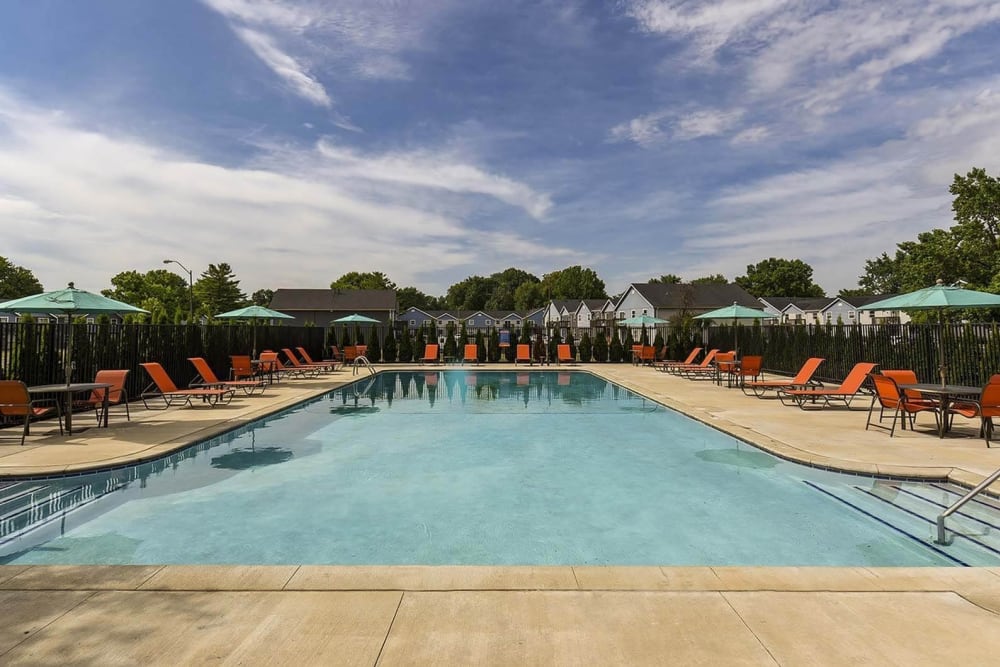 Sparkling pool with lounge chairs and umbrellas at The Meridian South, Indianapolis, Indiana