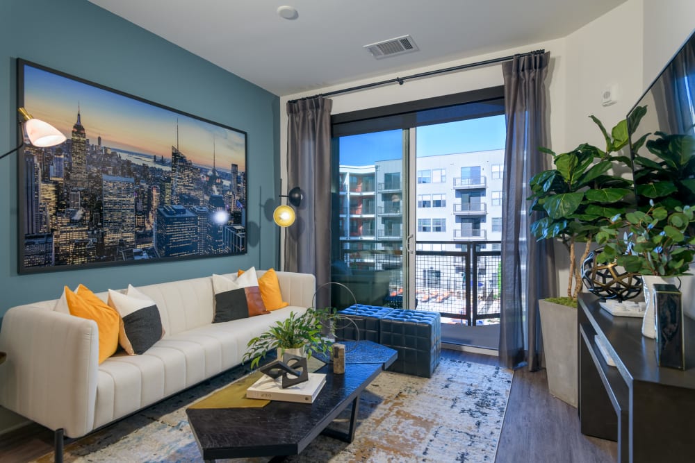Model living space with blue accents at Quill in Atlanta, Georgia