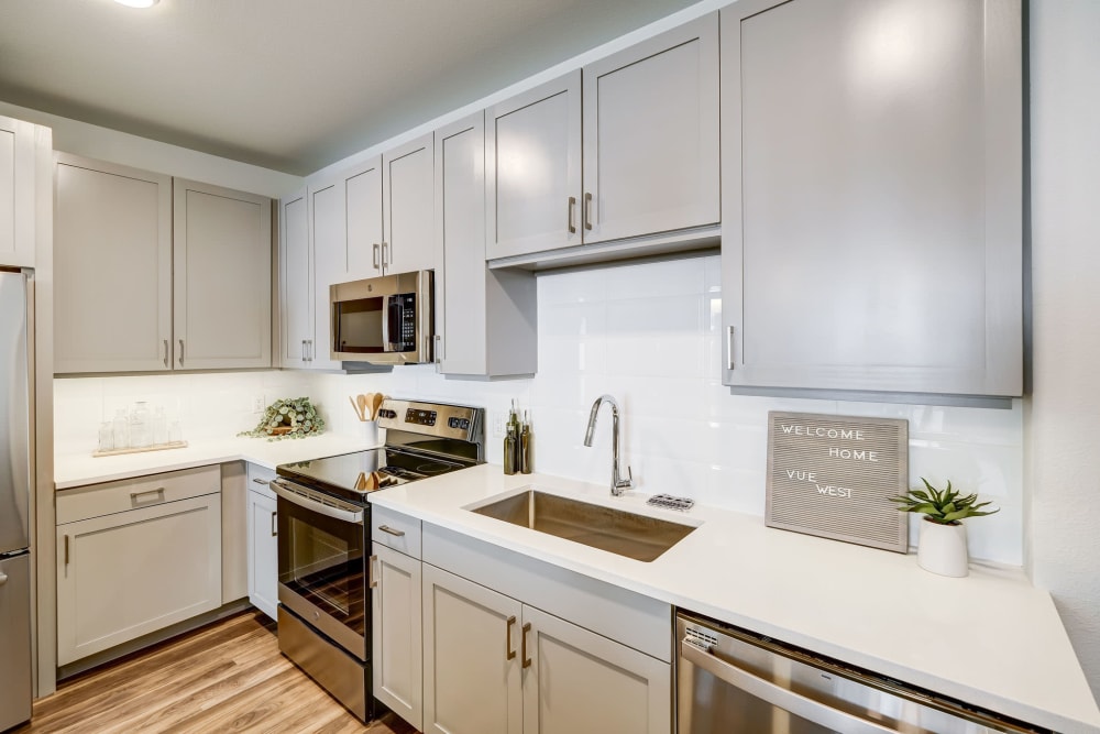 Kitchen with stainless-steel appliances at Vue West Apartment Homes in Denver, Colorado