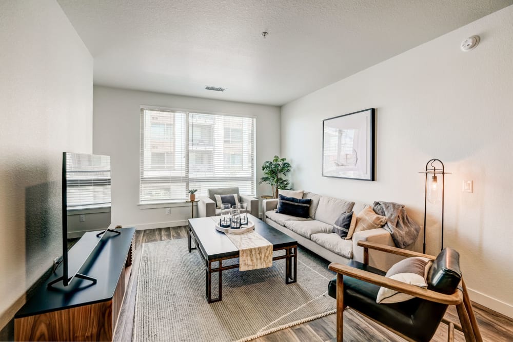 Living room with natural light from the windows at Vue West Apartment Homes in Denver, Colorado