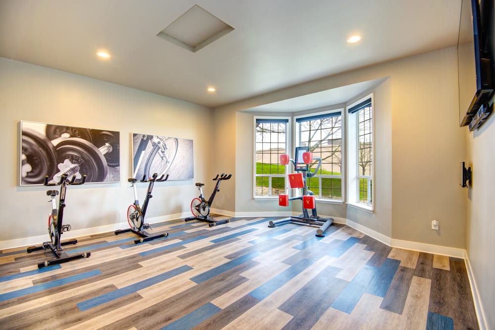 Fitness center with plenty of individual workout stations at Wellington Apartment Homes in Silverdale, Washington