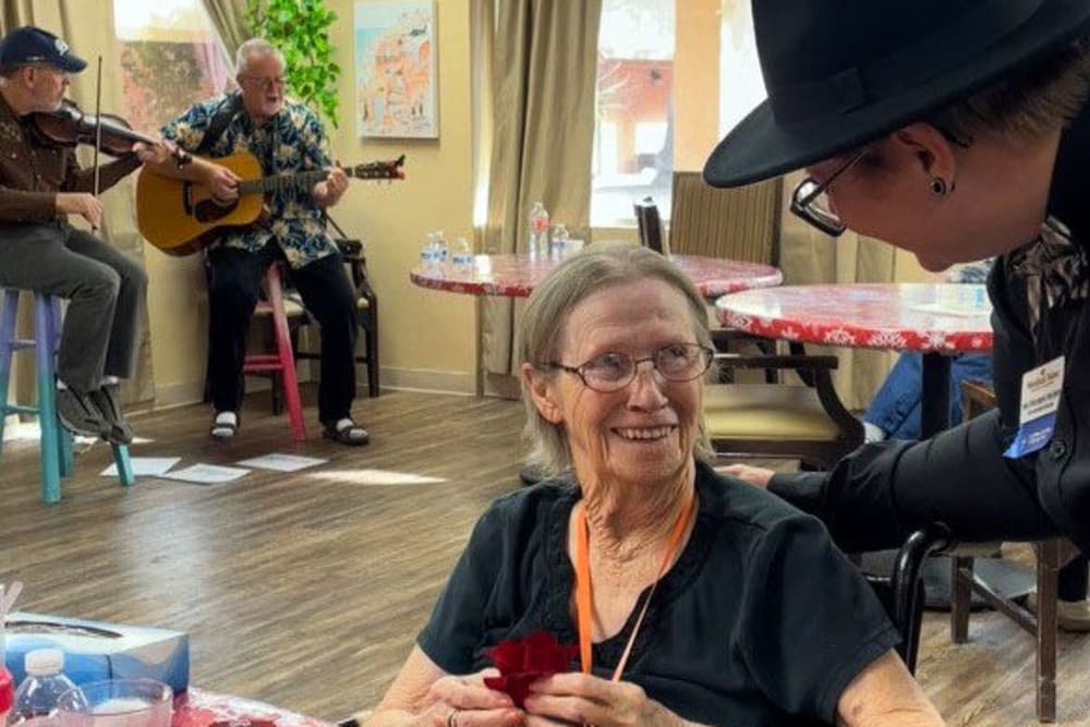 Communicating with residents at Woodland Palms Memory Care in Tucson, Arizona