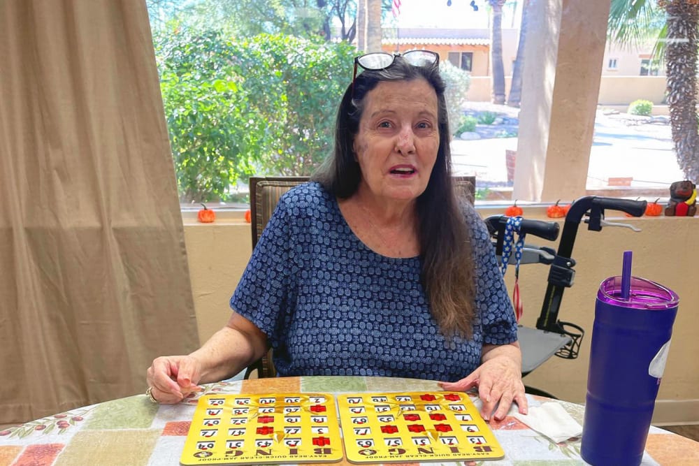 Playing bingo with residents at Woodland Palms Memory Care in Tucson, Arizona