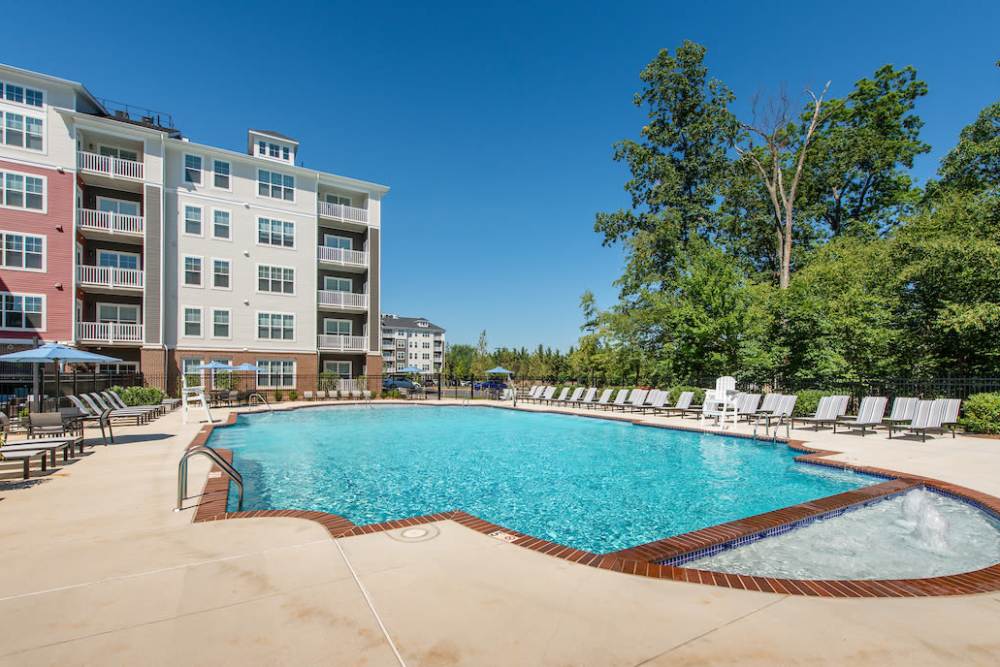 Pool area with lounge seating at  The Elms at Century in Germantown, Maryland