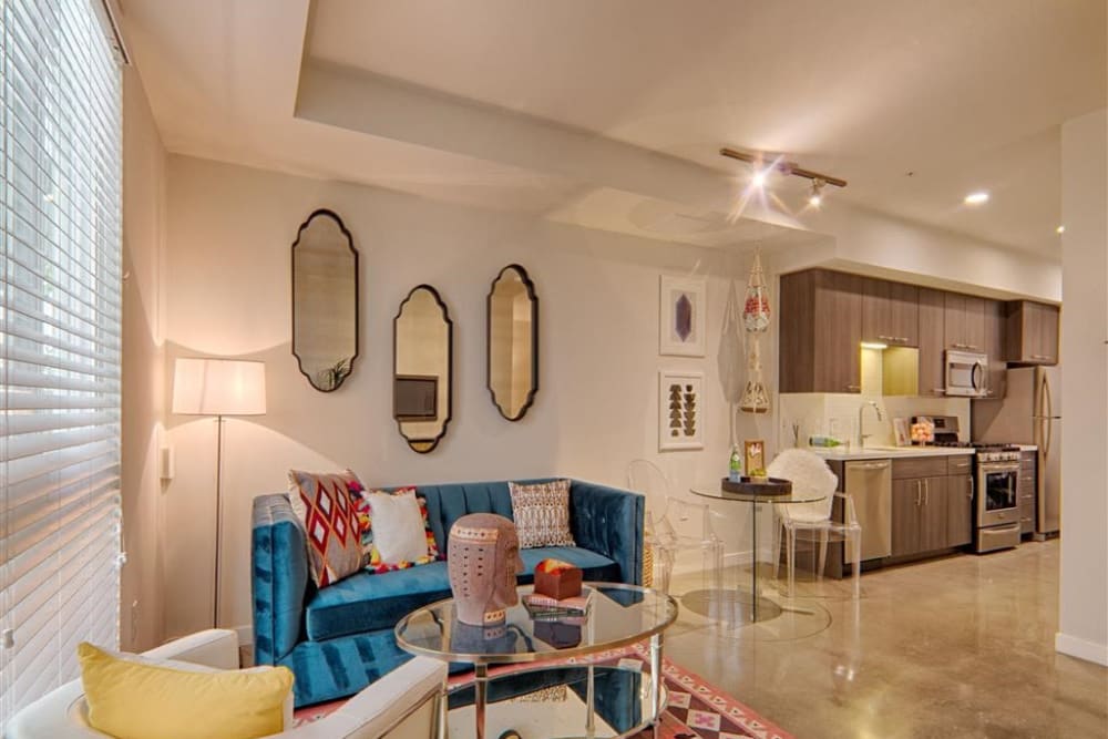 Modern living room with hardwood floors at Angelene Apartments in West Hollywood, California