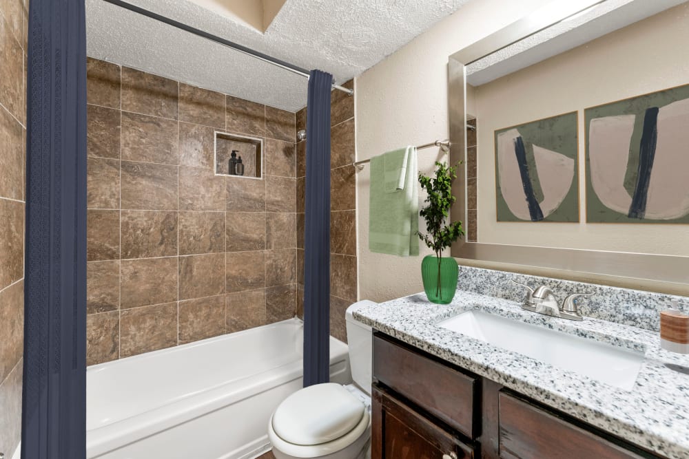 Bathroom with large mirrors at Avondale Reserve Apartment Homes in Avondale Estates, Georgia