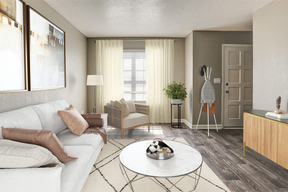 Living room with hardwood-style flooring at Country Oaks Apartments in Hixson, Tennessee