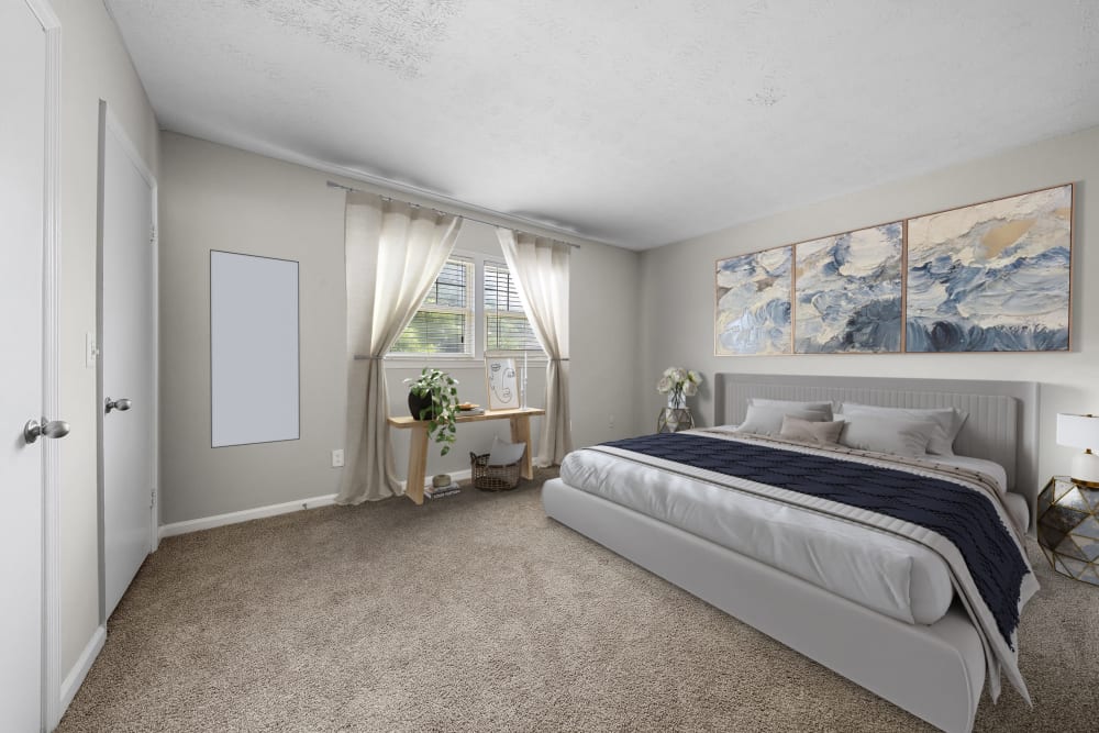 Spacious carpeted bedroom at The Crossing at Henderson Mill Apartment Homes in Atlanta, Georgia