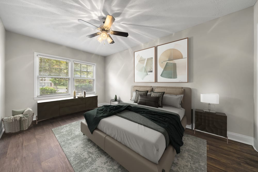 Bedroom with hardwood flooring at The Crossing at Henderson Mill Apartment Homes in Atlanta, Georgia