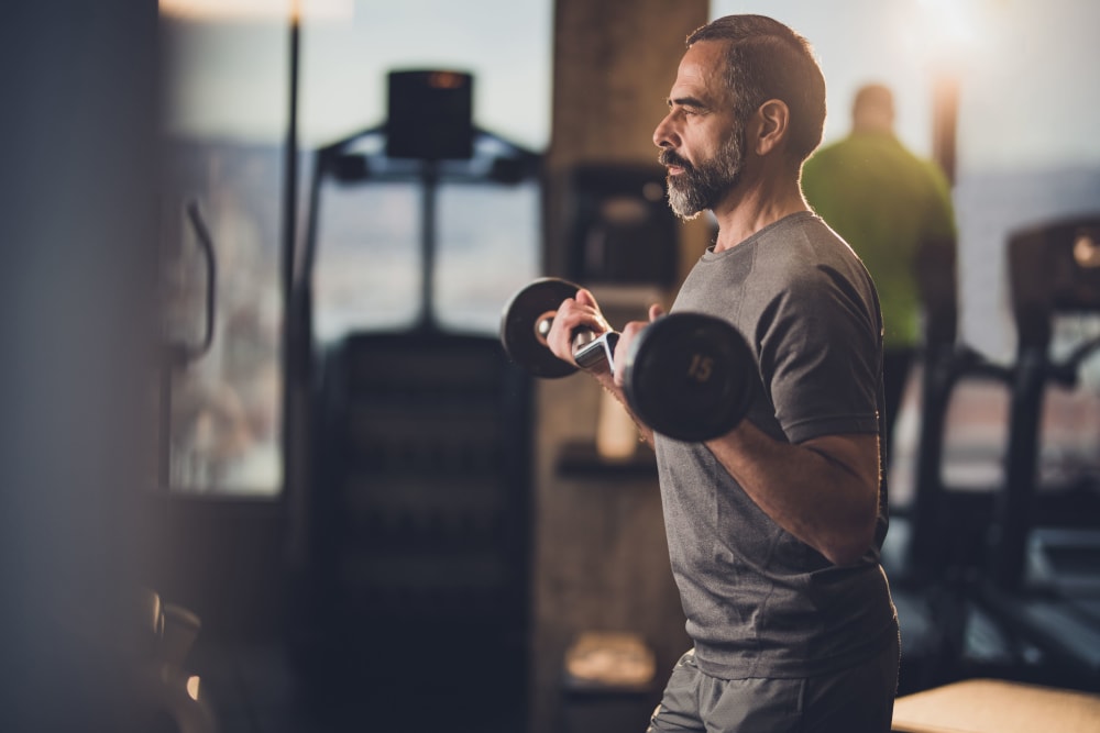 Resident working out in the fitness center at Mariposa at Jason Avenue in Amarillo, Texas