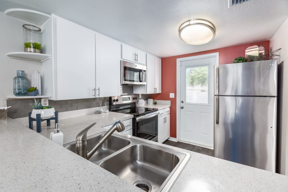 Kitchen with stainless steel appliances at Barrington Place at Winter Haven in Winter Haven, Florida