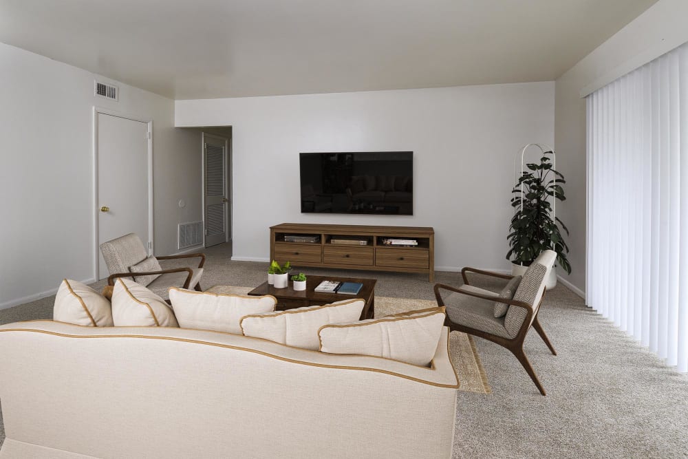 model carpeted living room with couches and a tv at Westover Pointe in Wilmington, Delaware