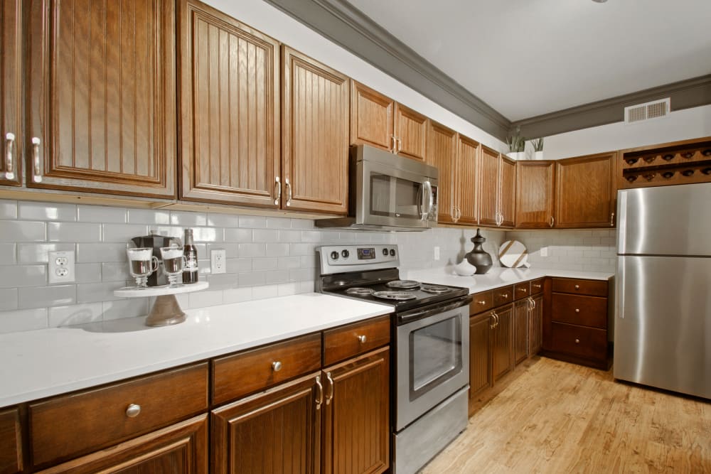Model kitchen with wood accents at Marquis on Evans in San Antonio, Texas