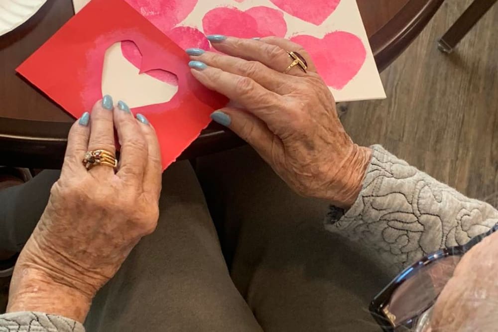 Resident making Valentine card at Harmony Senior Services