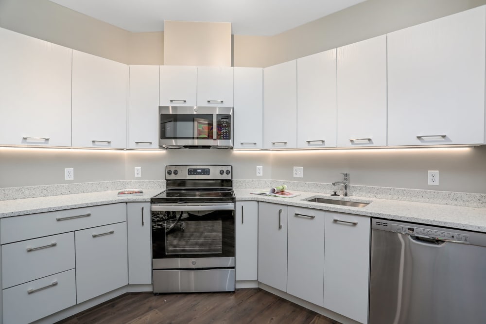 Model kitchen with white cabinetry at Town Court in West Bloomfield, Michigan