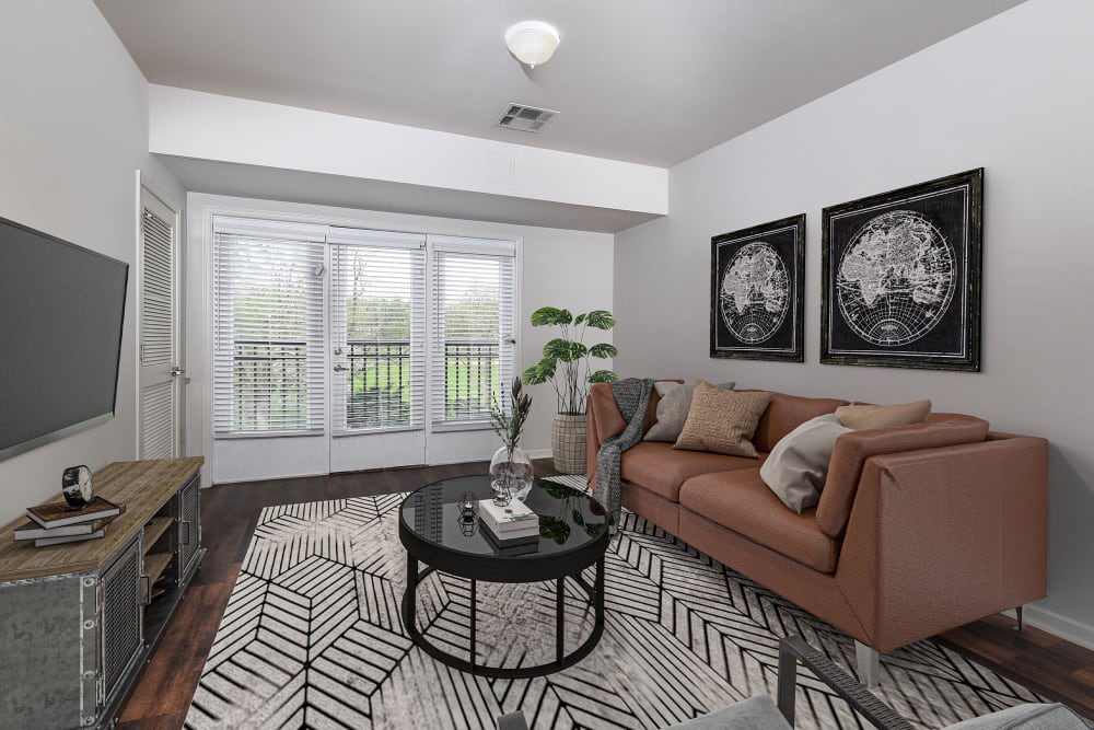 Model living room with sliding glass door at Parc at Maplewood Station, Maplewood, New Jersey