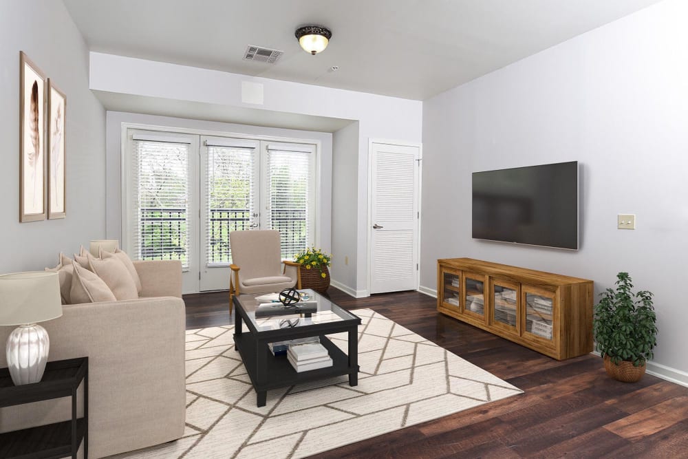 Model living room with TV at Parc at Maplewood Station, Maplewood, New Jersey