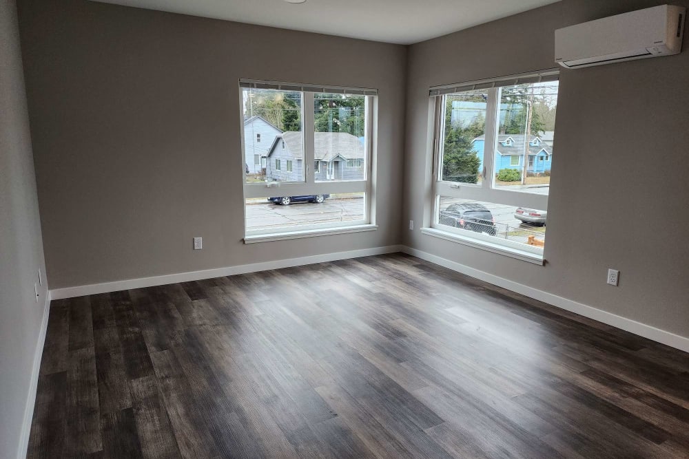 Living room with wood-style flooring at Westend II in Marysville, Washington