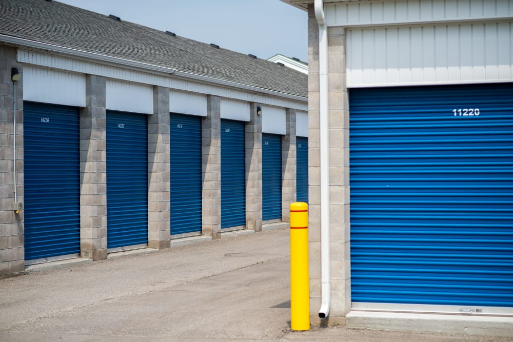 Bright blue storage unit doors at Apple Self Storage - Peterborough in Peterborough, Ontario