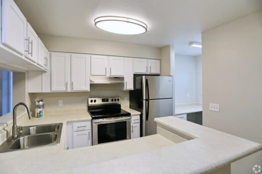 Kitchen with nice lighting at Madison Park Apartments in Bothell, Washington