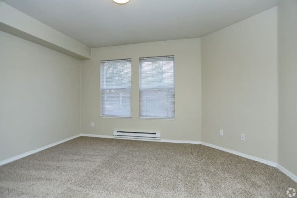 Bedroom with plush carpet at Madison Park Apartments in Bothell, Washington