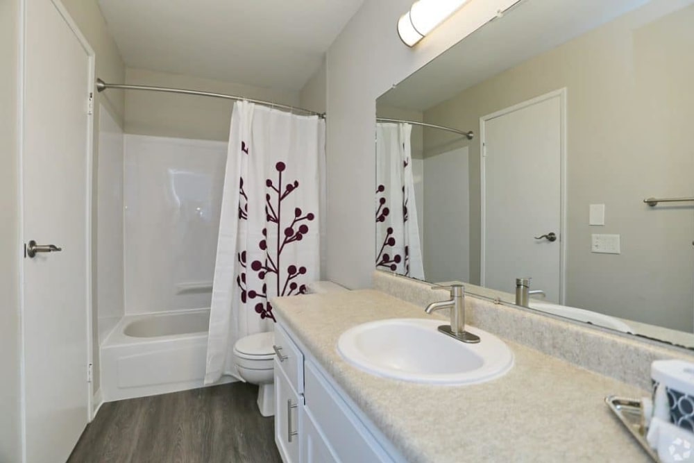 Bathroom with large vanity at Madison Park Apartments in Bothell, Washington