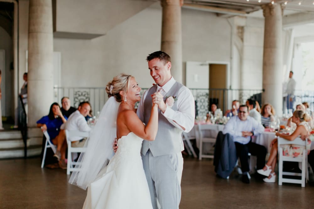 Bride and groom dancing at their wedding at The Whitcomb Senior Living Tower in St. Joseph, Michigan