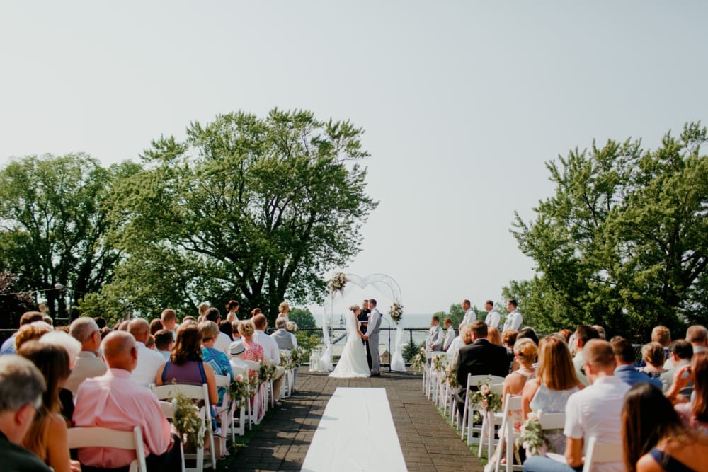 Couple kissing at their wedding at The Whitcomb Senior Living Tower in St. Joseph, Michigan