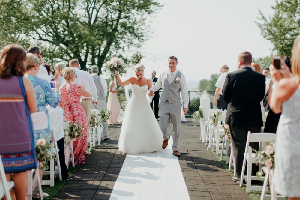 Wedding couple going down the aisle at The Whitcomb Senior Living Tower in St. Joseph, Michigan