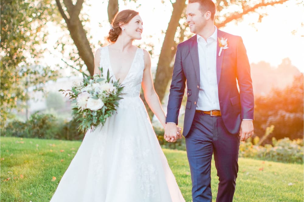 Bride and groom outdoors together at The Whitcomb Senior Living Tower in St. Joseph, Michigan