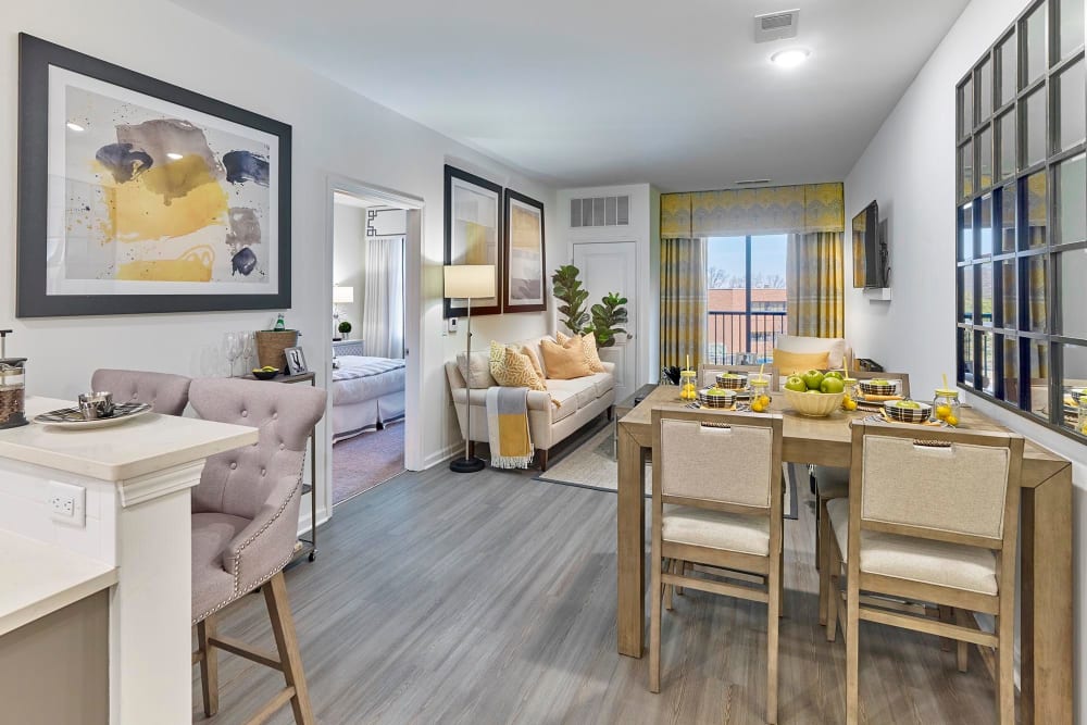 Living room with dining table at The Grande at MetroPark in Woodbridge, New Jersey