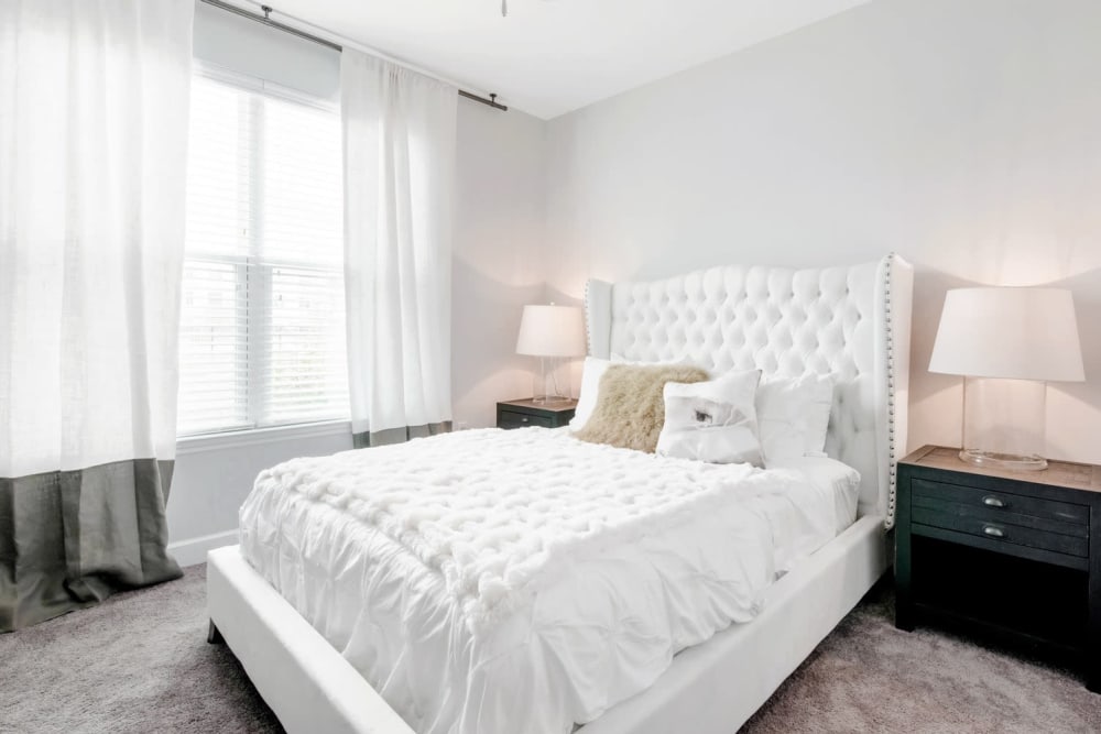 Model bedroom with large windows at Capital Crest at Godley Station in Savannah, Georgia