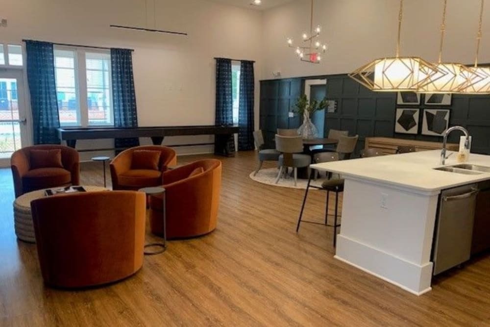 Community gathering area with kitchen space at Avion Point Apartments in Charlotte, North Carolina