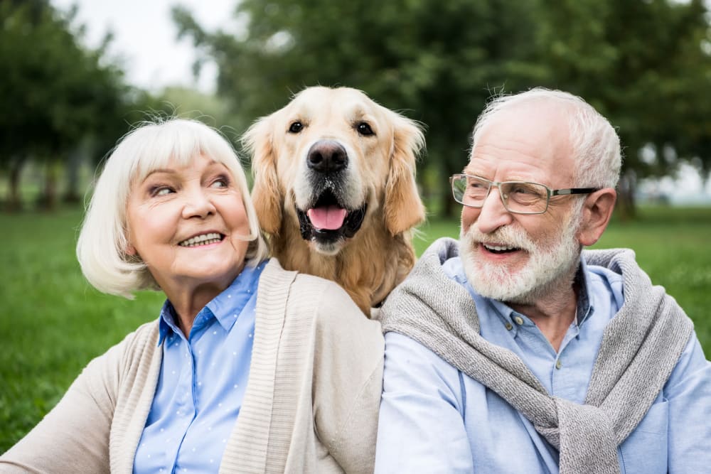 Residents with their dog Vista Prairie at Goldfinch Estates in Fairmont, Minnesota