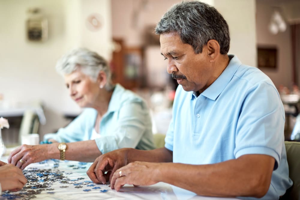 Residents doing a puzzle at Vista Prairie at Copperleaf in Willmar, Minnesota