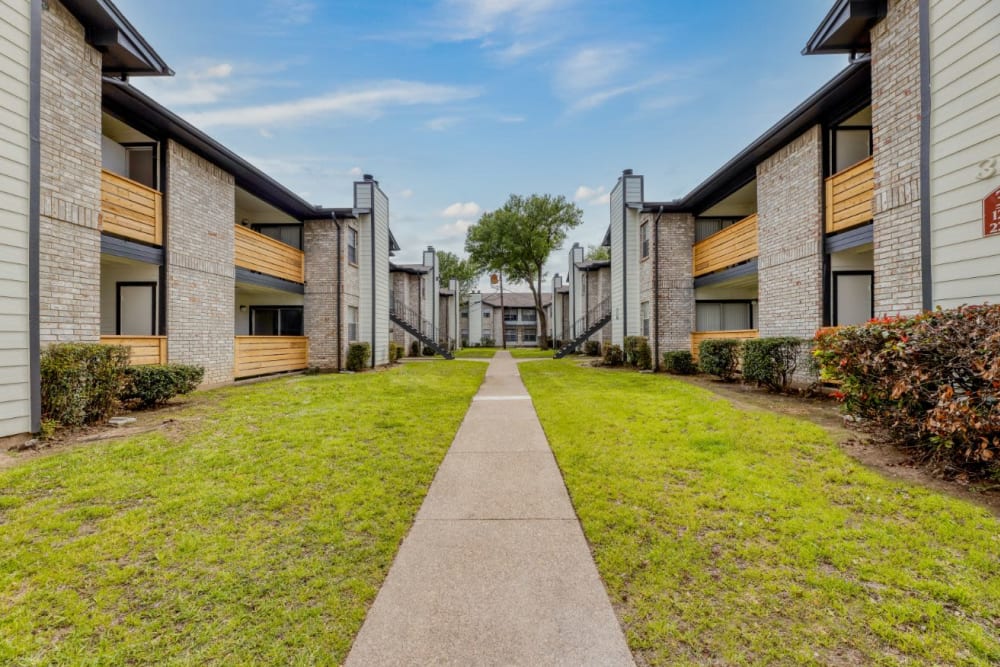 Walkway at Marshall Apartment Homes in Balch Springs, Texas