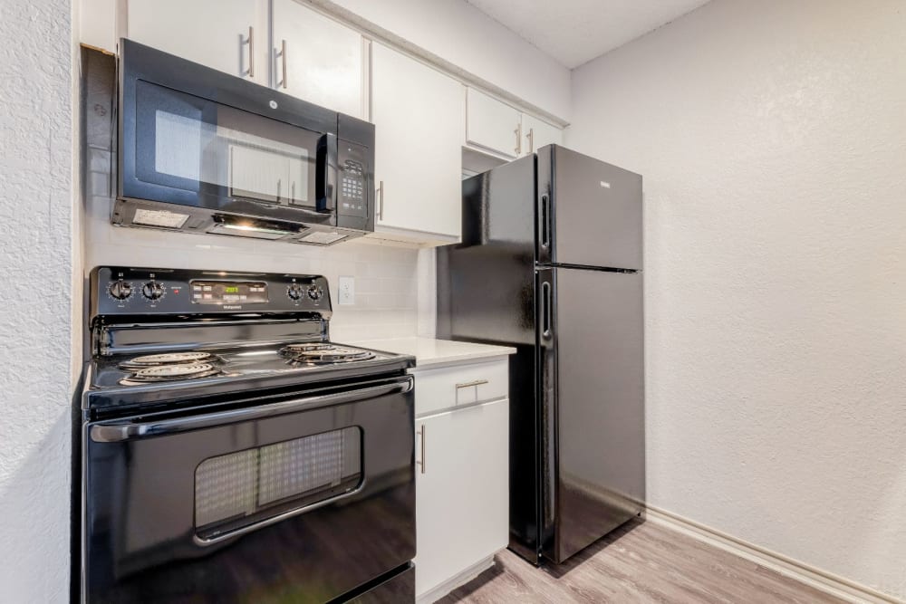 Kitchen with modern appliances at Marshall Apartment Homes in Balch Springs, Texas