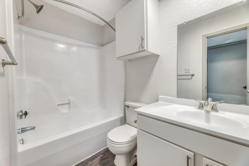 Bathroom with white finish at Marshall Apartment Homes in Balch Springs, Texas