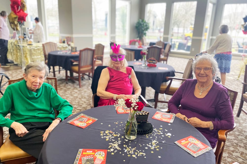 Three elderly women at an event