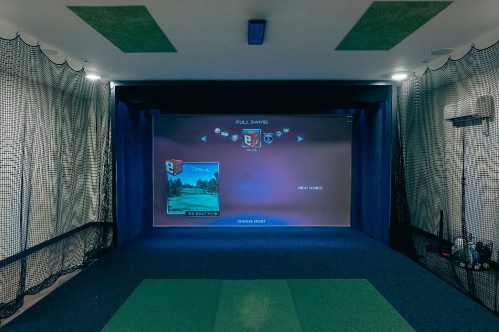 Golf simulator room in Anvil 38 Apartments in Lafayette, Indiana