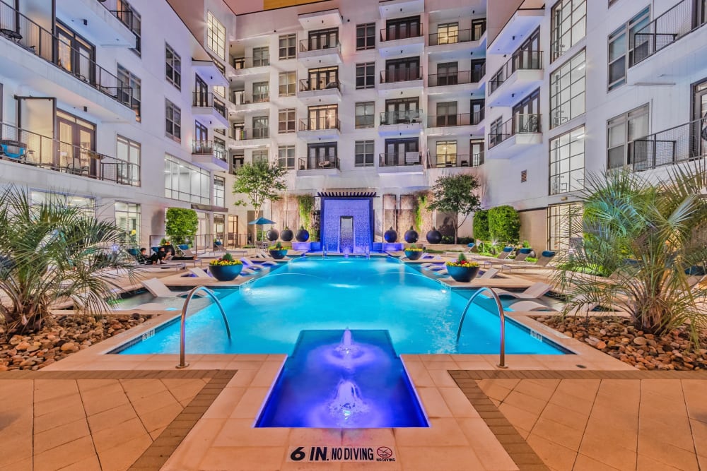 Pool with palm trees at Anthem Cityline in Richardson, Texas