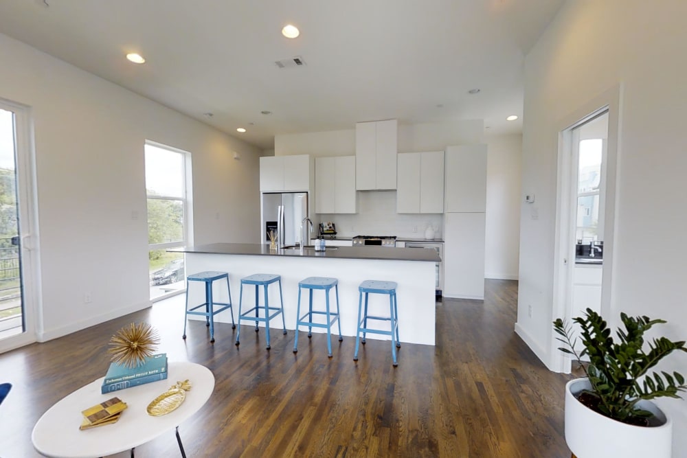 Eat-in kitchen with hardwood flooring at The Collection Townhomes in Dallas, Texas