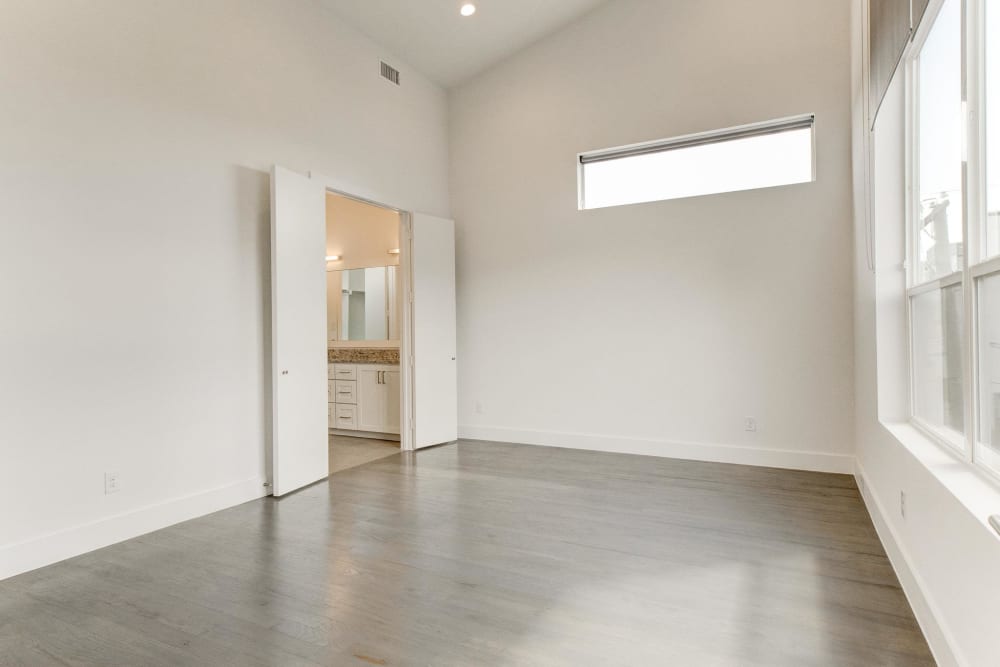 Spacious room with high ceilings and hardwood floors at The Collection Townhomes in Dallas, Texas