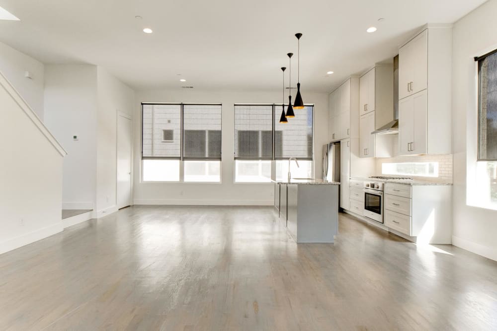 Spacious living room area and kitchen at The Collection Townhomes in Dallas, Texas