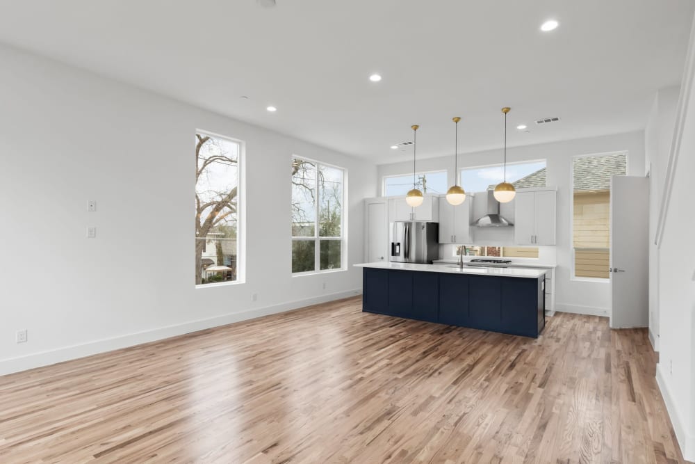 Large spacious kitchen and dining area with beautiful hardwood floors at The Collection Townhomes in Dallas, Texas