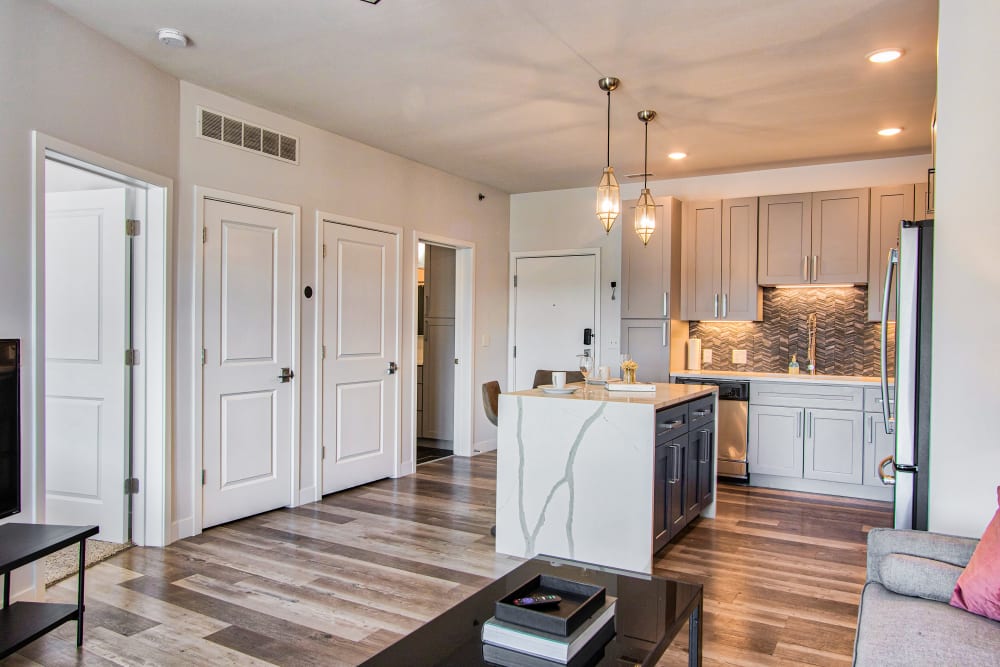 View of the kitchen from the living room at Steelyard Apartments in St. Louis, Missouri