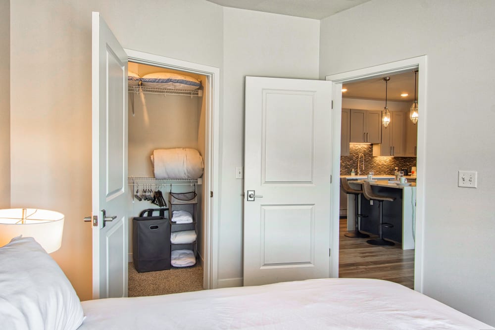 Bedroom with a walk-in closet at Steelyard Apartments in St. Louis, Missouri