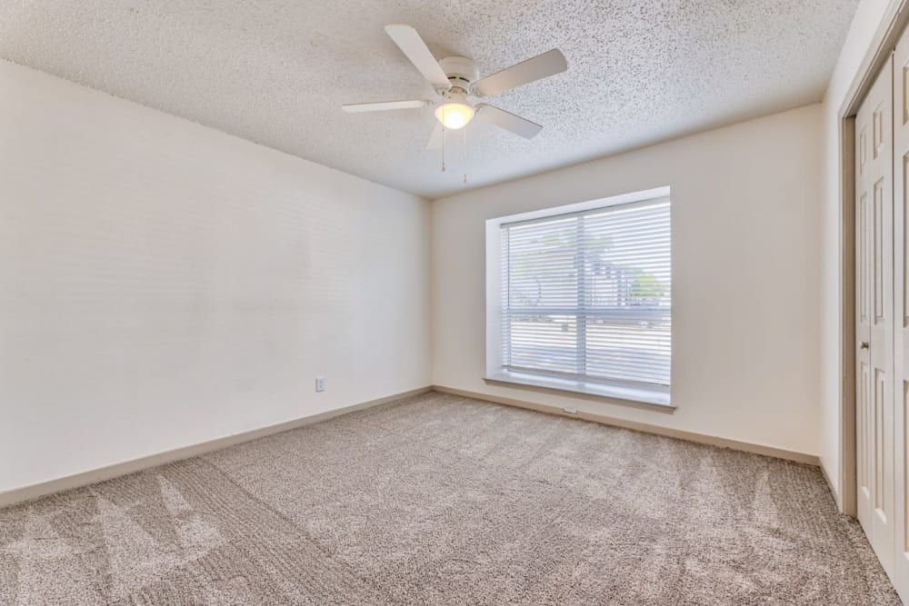 Unfurnished bedroom space at Lovato Apartment Homes in Garland, Texas