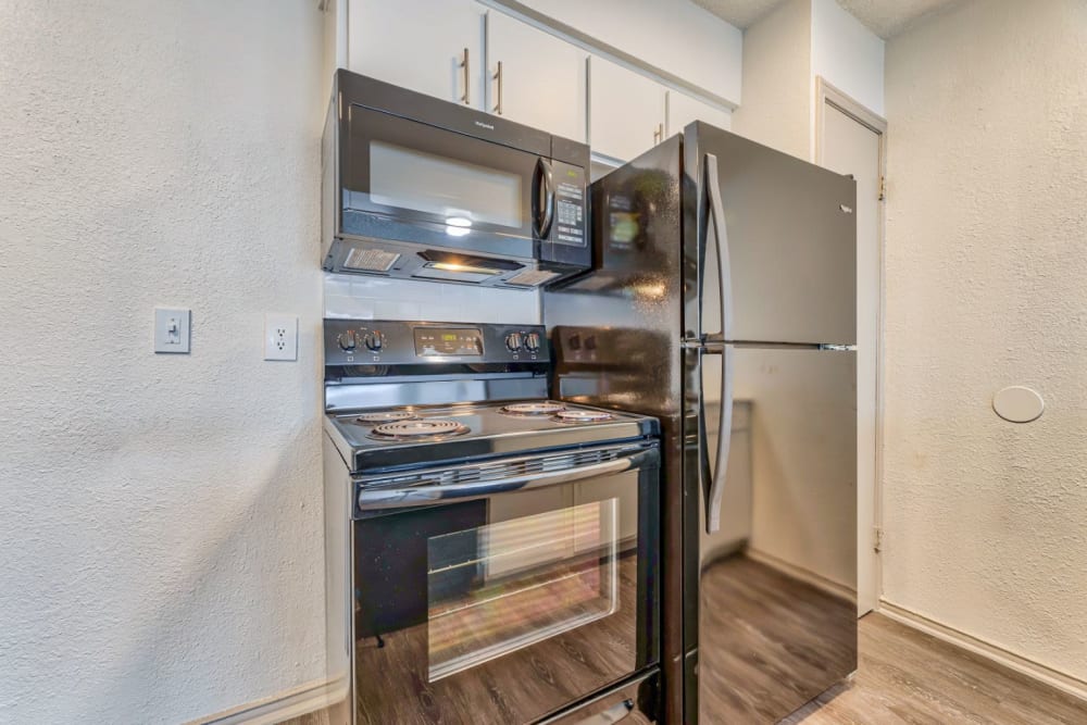 Modern kitchen amenities at Lovato Apartment Homes in Garland, Texas